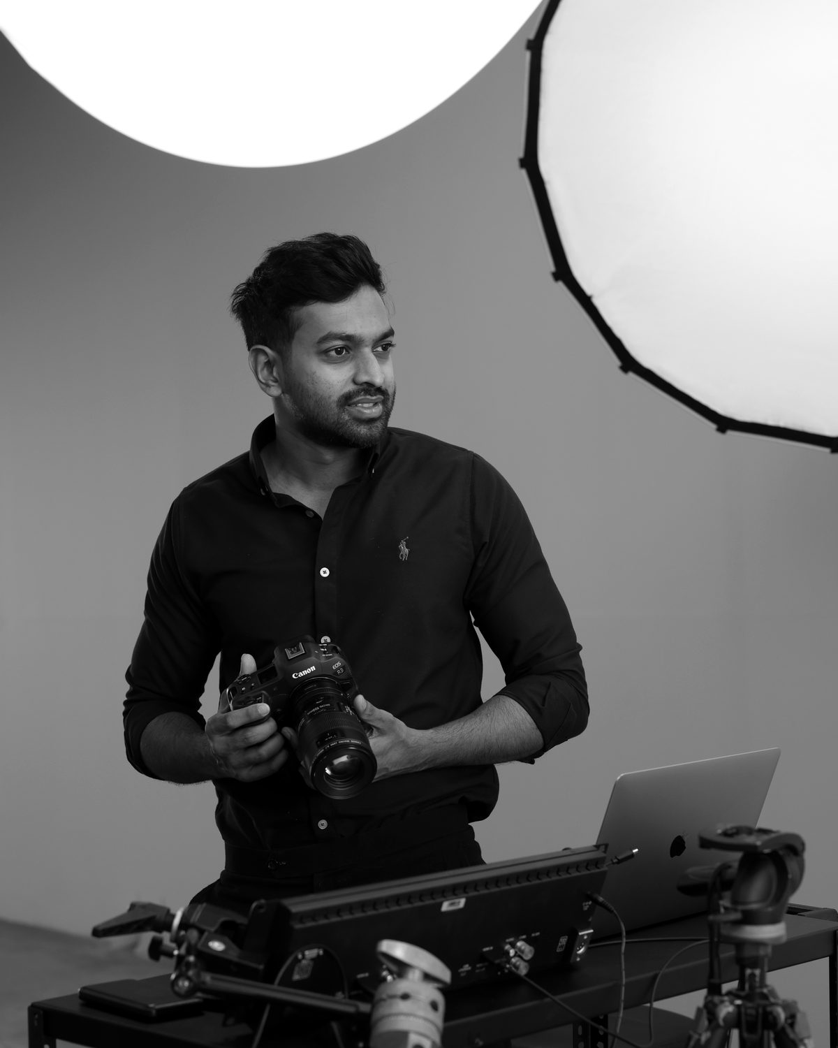 Karvin Fernando holding a cinema camera on a studio set