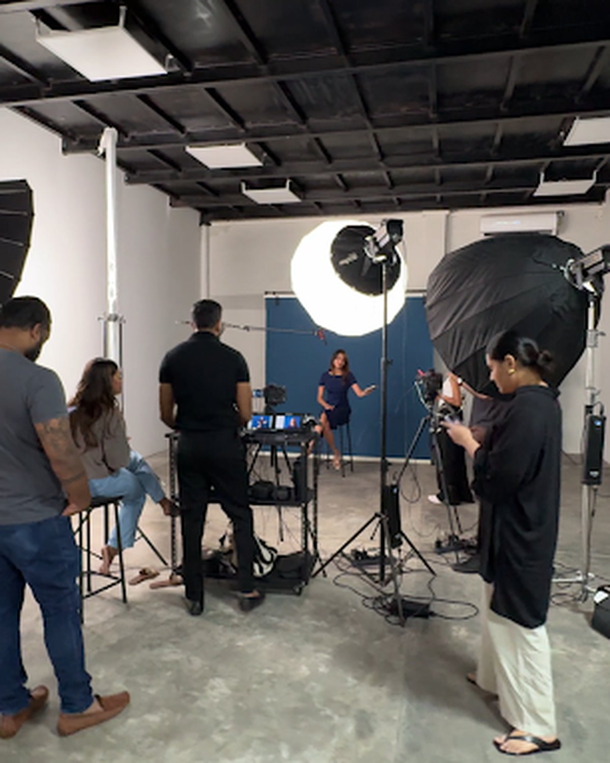 A crew shooting a portrait session inside Colombo Production Studio